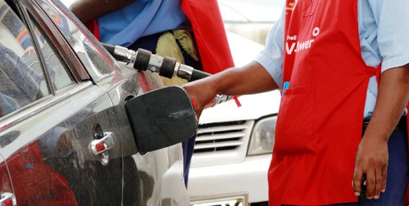 A pump attendant fuels a car: A time has come when Parliament must consider a decisive action on ERC price control powers