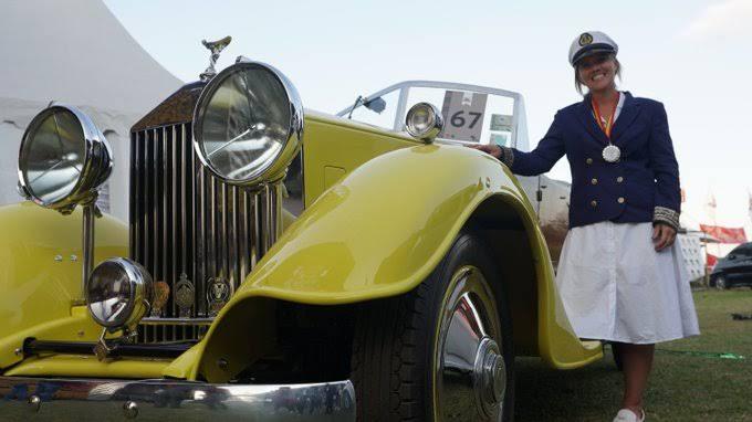 Veronica Wroe poses next to her 1930 Ford Model A at the 2019 Concours d'Elegance in Nairobi
