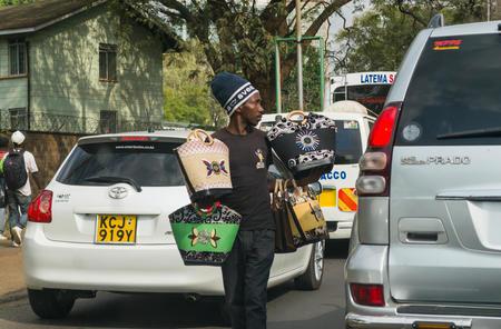 A hawker selling handbags to motorists stuck in traffic on Uhuru Highway in Nairobi