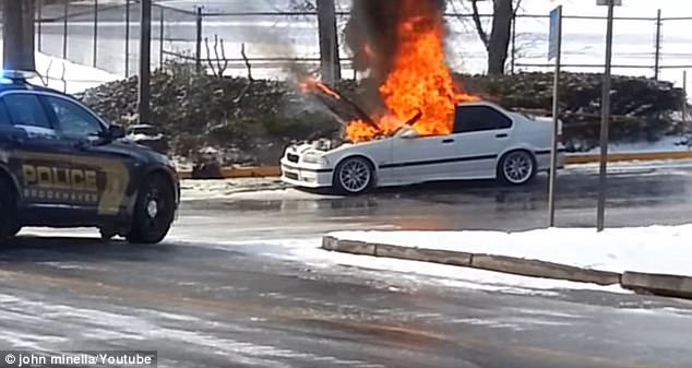 The BMW in Brookhaven, Georgia was quickly engulfed in flames as police looked on