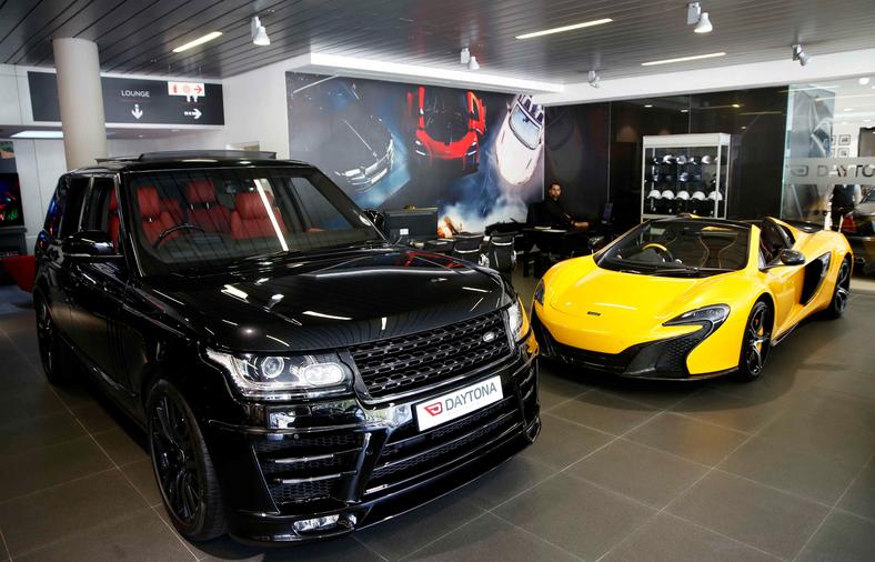 British-made luxury sports cars Range Rover and McLaren. 